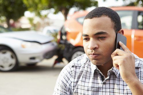 Male Driver Making Phone Call After Traffic Accident